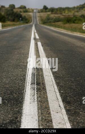 Double solid line on a country road Stock Photo