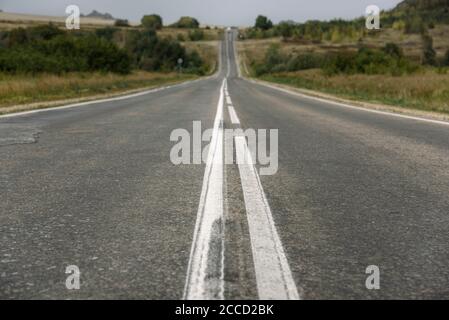 Double solid line on a country road Stock Photo