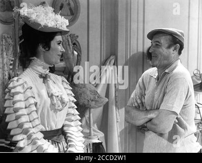 MARIANNE McANDREW and GENE KELLY on set candid during filming of HELLO , DOLLY ! 1969 director GENE KELLY music and lyrics Jerry Herman Chenault Productions / Twentieth Century Fox Stock Photo