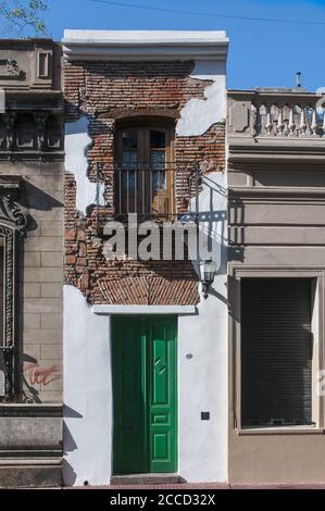 BUENOS AIRES, ARGENTINA - Sep 30, 2014: Casa Minima (The Minimal House), the narrowest house in Argentina, located in San Telmo, one of the oldest dis Stock Photo