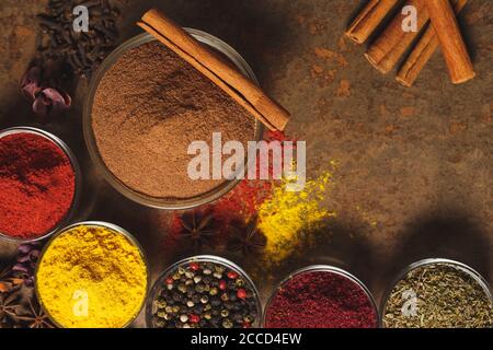 Ground Cinnamon. Place for text. Different types of Spices in a bowl on a stone background. The view from the top Stock Photo