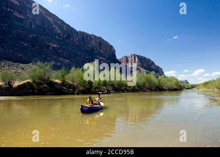 Big Bend National Park, Texas USA, March 15, 2007: Day canoeists floating the Rio Grande River just outside the mouth of Santa Elena canyon at the western end of Big Bend National Park. ©Bob Daemmrich Stock Photo