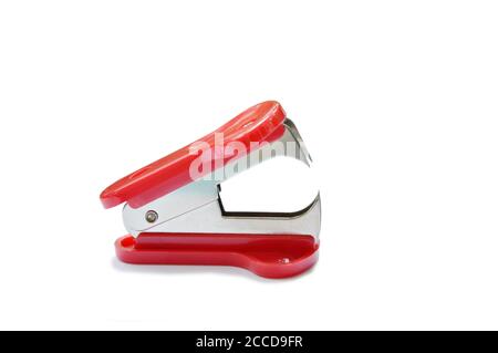 red staple remover and refill on white table Stock Photo