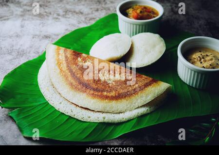 South Indian breakfast Idli Dosa sambar and chutney served in banana leaf Stock Photo