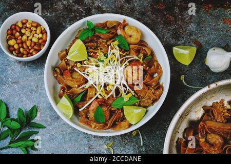 Homemade Shrimp Pad Thai with flat rice noodles Stock Photo
