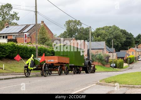 Thornby, UK. A old Steam Engine on the Welford road B5199 heading towards Welford stopped to take on water and repair leakage this afternoon, Northamptonshire, Credit: Keith J Smith./Alamy Live News Stock Photo