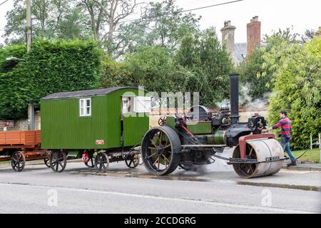 Thornby, UK. A old Steam Engine on the Welford road B5199 heading towards Welford stopped to take on water and repair leakage this afternoon, Northamptonshire, Credit: Keith J Smith./Alamy Live News Stock Photo