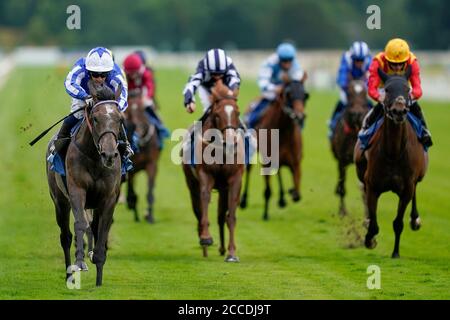 Silvestre De Sousa on board Angel Power (left) on their way to winning the British Stallion Studs EBF Fillies' Handicap during day three of the Yorkshire Ebor Festival at York Racecourse. Stock Photo