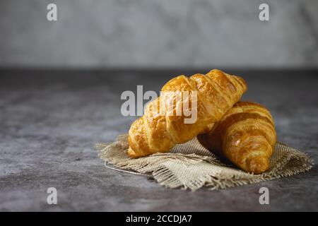 Tasty croissants on table Stock Photo