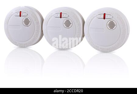 Productshot with reflection of multiple smoke detectors on a table Stock Photo