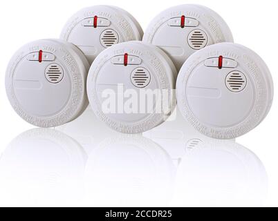 Productshot with reflection of multiple smoke detectors on a table Stock Photo