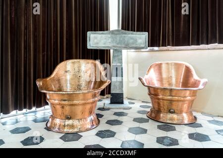 Vintage, golden and shiny thermal bathtub used in Luso, Portugal Stock Photo