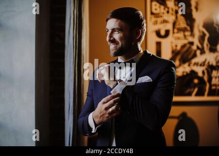 Man, festively dressed, suit, bow tie, Stock Photo