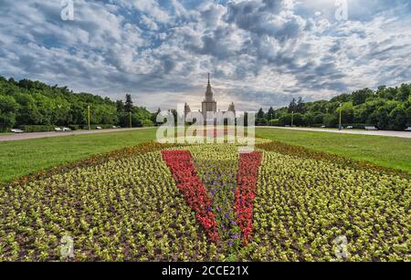 Moscow,Russia - June 15, 2020: the Moscow Lomonosov State University and the Wide flowerbed with flowers,horizontal shot. Stock Photo