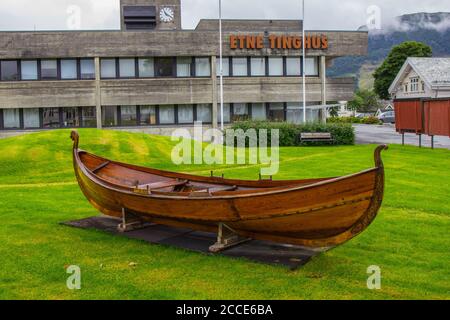 Viking drakkar on the lawn near Etne Tinghus. Etne is a municipality in Vestland county, Norway. It is located in the traditional district of Stock Photo