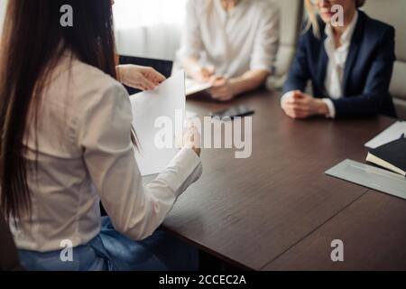Two female human resources managers conducting job interview with woman applicant in office. Getting a new job concept Stock Photo
