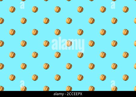 Seamless Pattern made with pumpkin vegetable on blue background. Stock Photo