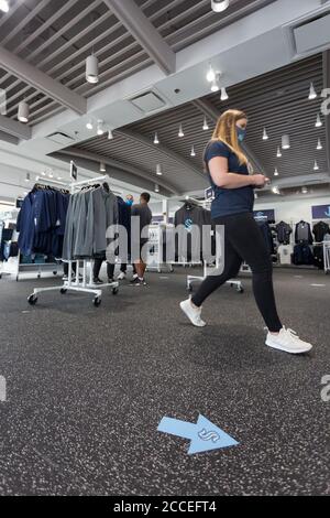 Seattle, Washington, USA. 21st July, 2020. Arrows mark one-way aisles during the grand opening of the Seattle Kraken flagship store. The store opens with COVID-19 safety precautions in place including a requirement for face coverings, physical distancing and appointment-only shopping. Credit: Paul Christian Gordon/Alamy Live News Stock Photo