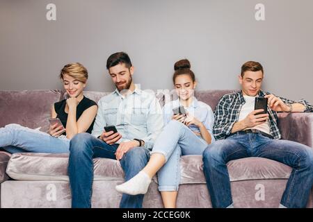 young people are dependent on gadgets. close up shot. online conversation, chat. the influence of the Internet. free wi-fi Stock Photo