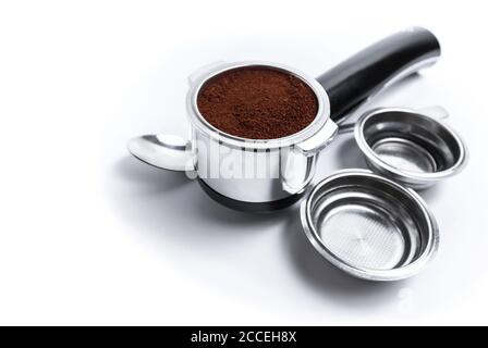 Espresso holder and replaceable coffee filters. The horn from the coffee machine on a white background. Selective focus. High quality photo Stock Photo