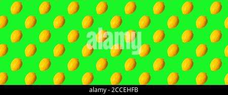 Seamless Pattern made with lemon fruit on green background. Stock Photo