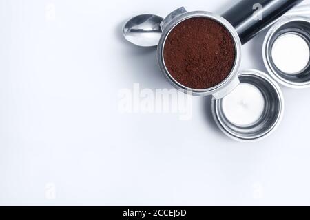 Espresso holder and replaceable coffee filters. The horn from the coffee machine on a white background. Selective focus. High quality photo Stock Photo