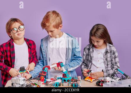 Creative Engineering Robotsa portrait of creative enthusiastic children spending time in engineering ...