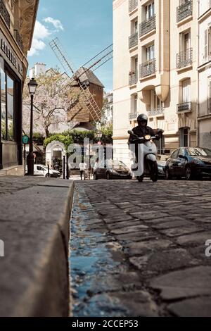 Europe, France, Paris, Montmartre, Windmill, Mill with blooming Tree, Street View, Low Angle, Stock Photo