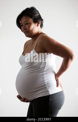 Pregnant woman in pain Stock Photo
