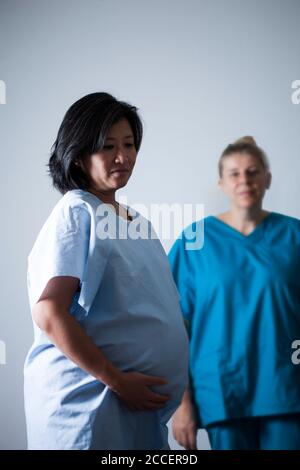 Pregnant woman in early labour Stock Photo