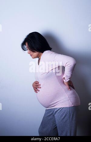 Pregnant woman in pain Stock Photo
