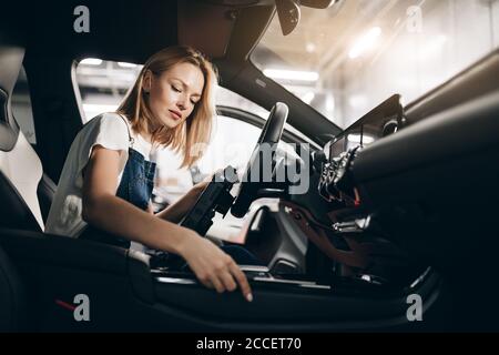 nice female mechanic working with tablet at the garage. gadget concept Stock Photo