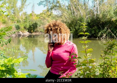 woman talking on the phone with her smartphone Stock Photo