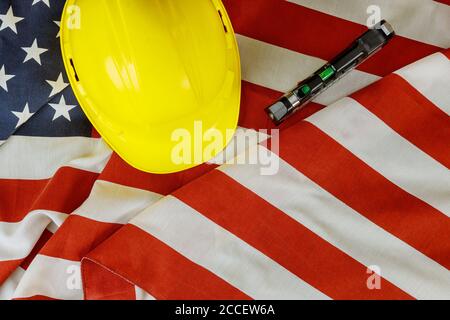 USA flag and yellow helmet Happy Labor day american patriotic Stock Photo