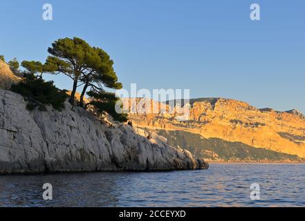 A boat tour along the spectacular Calanques National Park at sunset, Cassis FR Stock Photo
