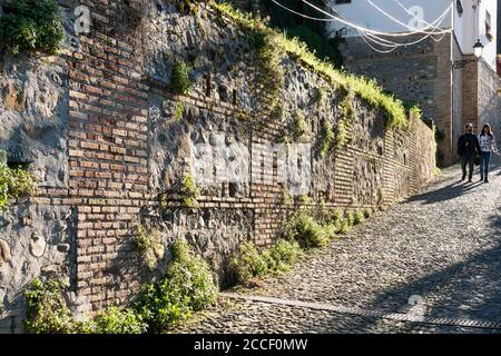 Granada (Spain), Ascent to the Alhambra, morning light, couple Stock Photo