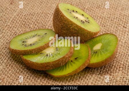 Sliced Kiwi Fruits On Sackcloth Stock Photo
