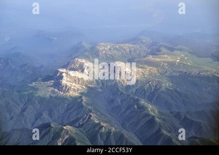 View from the plane to the Western Caucasus mountains. Fisht-Oshten massif with mountains Fisht, Oshten, Pshekhu-Su. Territory of the Caucasian State Stock Photo