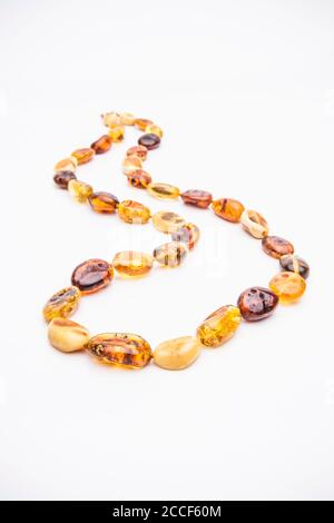 Amber jewelry isolated on white background Stock Photo