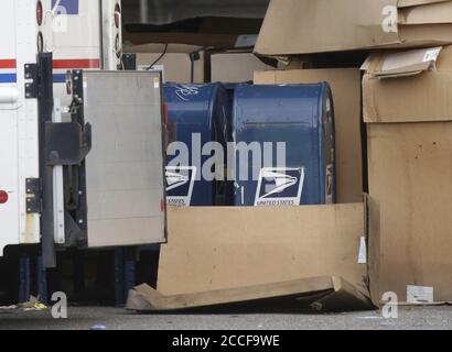 Bronx, United States. 21st Aug, 2020. Dozens of US Postal Service mail boxes are stored in a parking lot behind a Bronx Post Office location in New York City on Friday, August 21, 2020. Election fraud concerns and comments made by President Donald Trump have placed a question mark on mail in voting for the 2020 Election. Photo by John Angelillo/UPI Credit: UPI/Alamy Live News Stock Photo