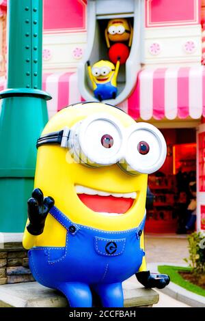 Close up of HAPPY MINION statue in Universal Studios Japan. Minions are famous character from Despicable Me animation. Stock Photo