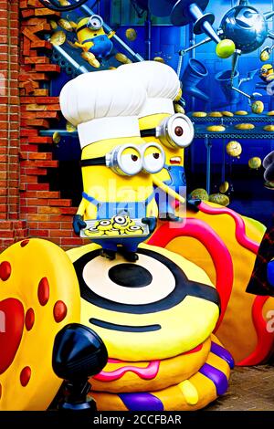 Close up of HAPPY MINION statue in Universal Studios Japan. Minions are famous character from Despicable Me animation. Stock Photo