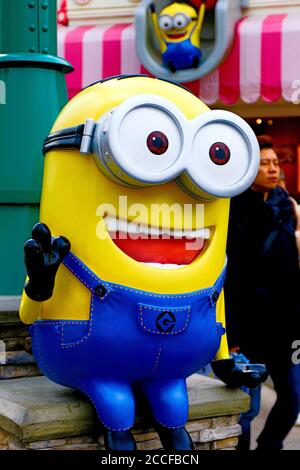 Close up of HAPPY MINION statue in Universal Studios Japan. Minions are famous character from Despicable Me animation. Stock Photo