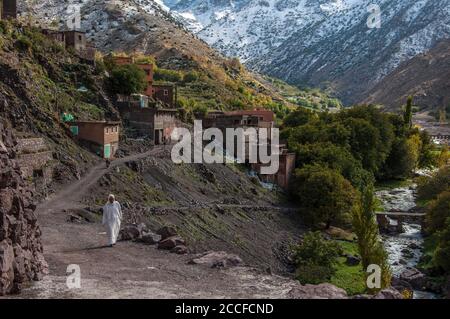 man wearing traditional Berber outfit in small village of Imlil in the Atlas Mountains of Morocco Stock Photo