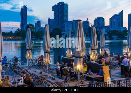 Vienna, river Alte Donau (Old Danube), floating restaurant 'Strandcafe' now open after corona closure, waiters with mouth nose protective mask, houses Stock Photo