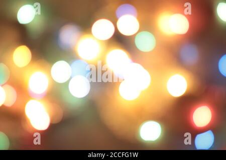 Christmas garlands, abstract blurred background with blurred lights of different colors. Christmas background, backdrop, background. Stock Photo