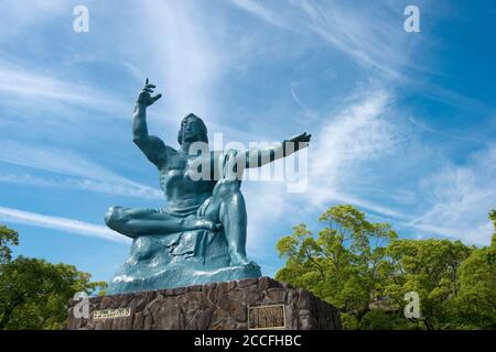 Peace Statue at Nagasaki Peace Park in Nagasaki, Japan. The Peace Park is commemorating the atomic bombing of the city on August 9, 1945 during WWII. Stock Photo