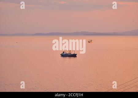 Vladivostok, Russia - Jun 11, 2020: view of the Amur Bay at sunset. Stock Photo