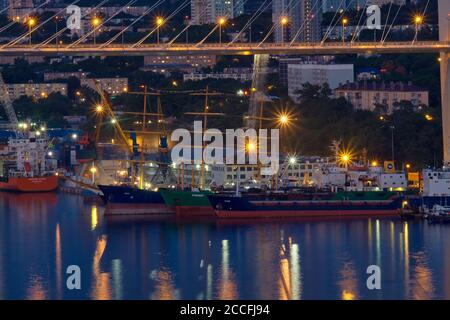 Vladivostok, Russia - Jun 11, 2020: Night view of the city of Vladivostok. Golden bridge in Vladivostok at night. Stock Photo