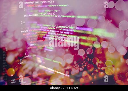 Programmer working in a software develop company office. Digital binary data on computer screen. Computer script typing work. Programming code abstrac Stock Photo
